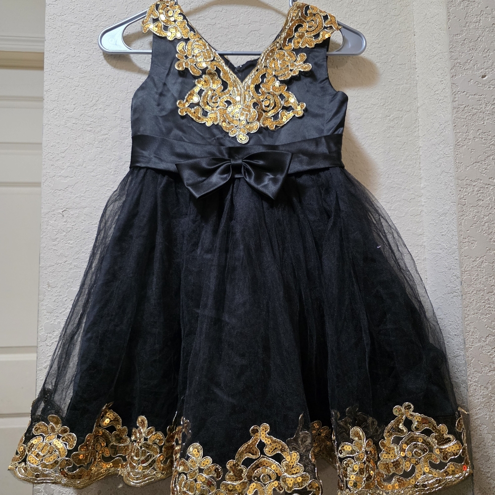 Elegant Black and Gold Dress with Bow